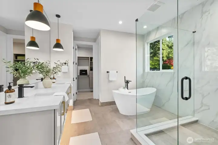 Primary bath suite features floating vanity, heated floors and luxurious dual-valve multi-fixture shower experience