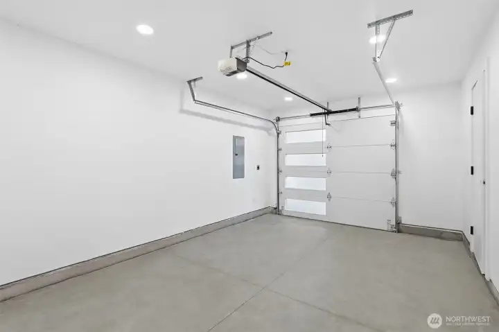 1-car garage, driveway parking, and space for RV parking. EV charger ready.