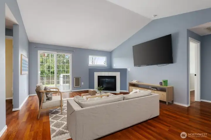 Virtually staged to highlight the cozy living room space.