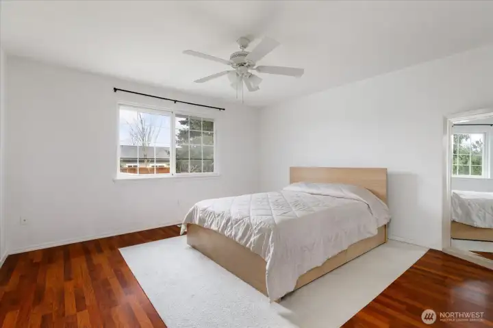 Primary bedroom situated separately from the other two bedrooms for added privacy.