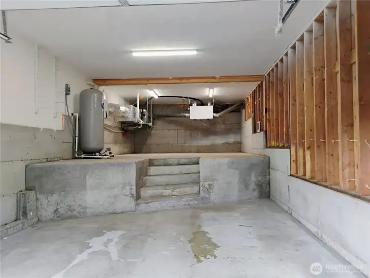Lower-level oversized garage/shop area with plenty of room for projects and gear