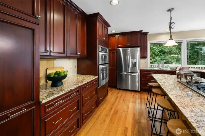 Custom cabinetry and pantry space keep everything organized.
