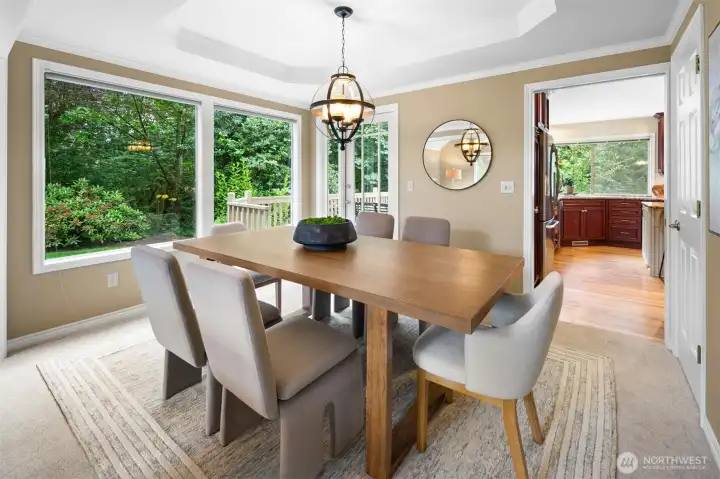 Oversized windows frame lush Northwest scenery.