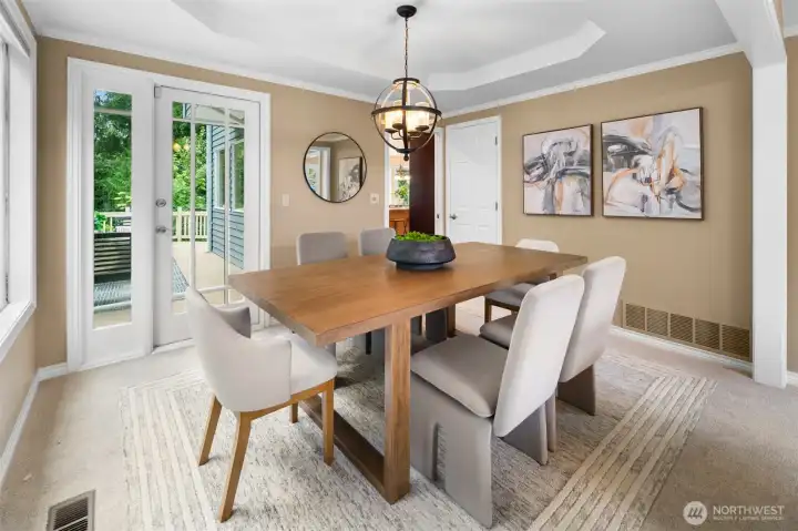 Large deck for outdoor dining and entertaining accessed off the formal dining room.