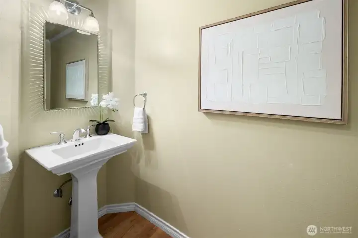 Main-floor powder room with modern fixtures and guest-friendly convenience.