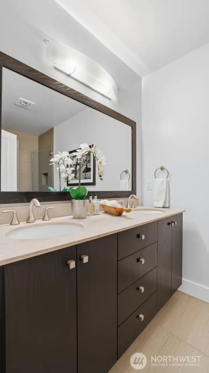 Primary suite attached bath with frameless walk-in shower