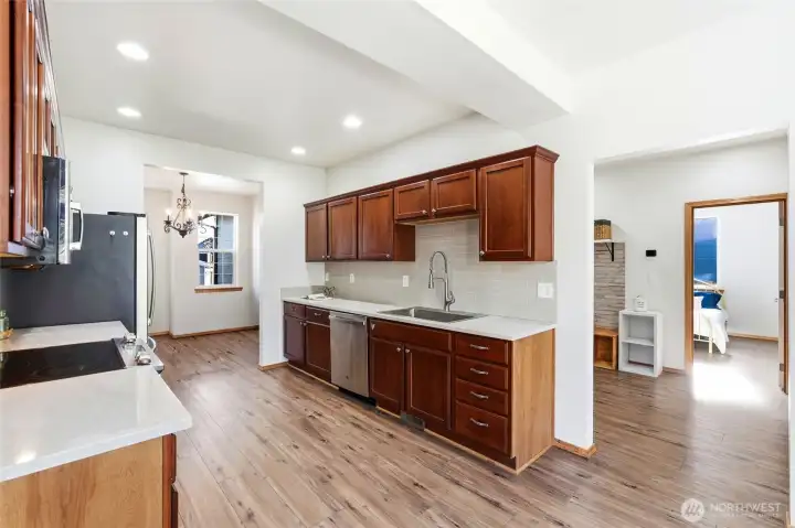 Generous prep space and cabinetry make cooking both functional and enjoyable.