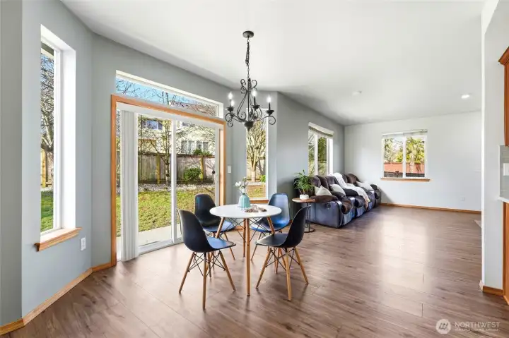 The sunny breakfast nook is the perfect spot for morning coffee or casual meals.