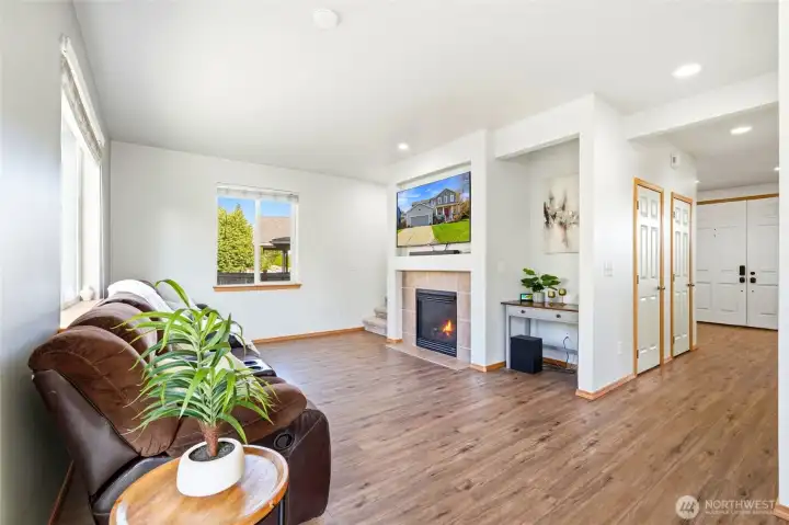 The family room is warm and welcoming with abundant natural light. The open-concept flow keeps everyone connected. A new smart thermostat ensures year-round comfort and energy efficiency.