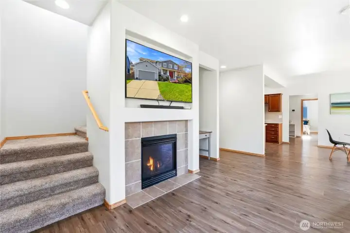 A cozy gas fireplace anchors the space, perfect for relaxing evenings.