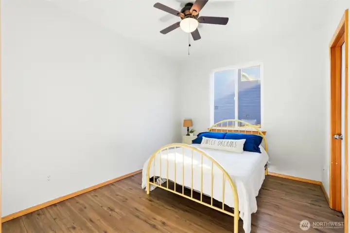 The main-floor bedroom offers excellent flexibility for guests or multi-generational living. It can also function beautifully as a private home office. All bedrooms have walk-in closets too!