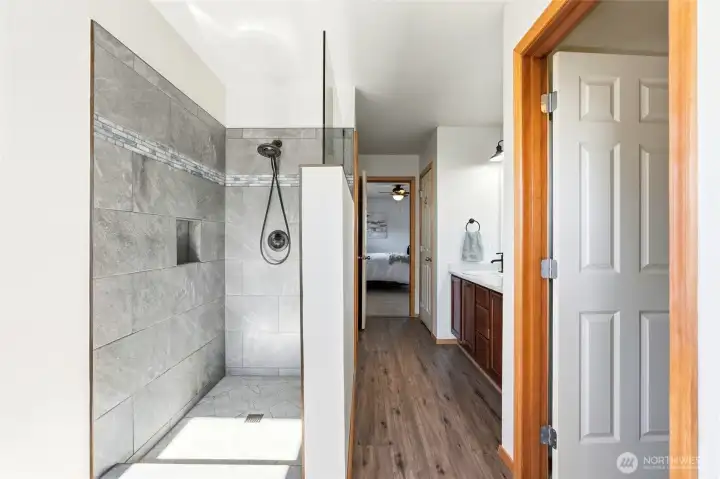 The layout provides comfort and privacy. It’s a spacious extension of the primary suite experience.