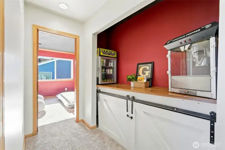 The dedicated movie room is the ultimate entertainment space.