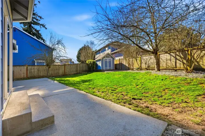 The fully fenced yard offers privacy and flexibility.