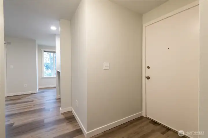 Entryway of the condo features plenty of space to hang coats and leave shoes.  There is a VERY large walk in closet as you enter this home.