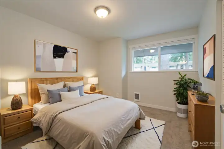 VIRTUALLY-STAGED!  Bedroom 1 of 3.  There is a large closet just behind the door.  Ample room for a queen sized bed plus dresser and nightstands in this room.