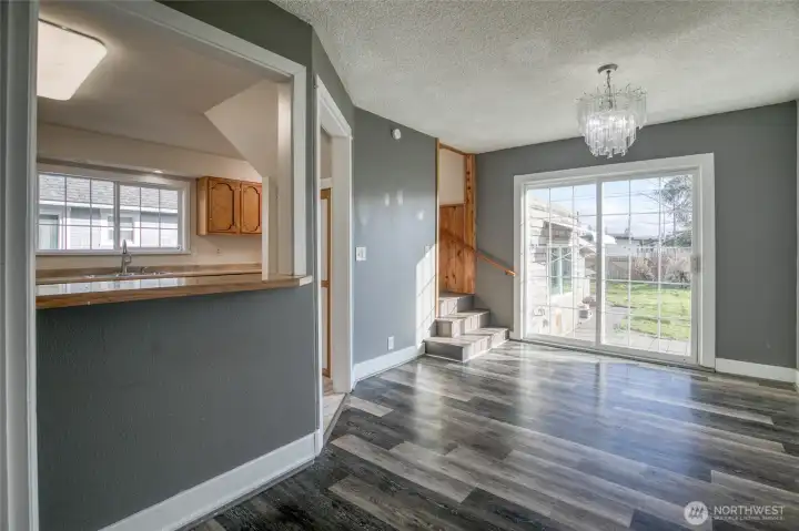 Stairs take you upstairs to primary bed/bath