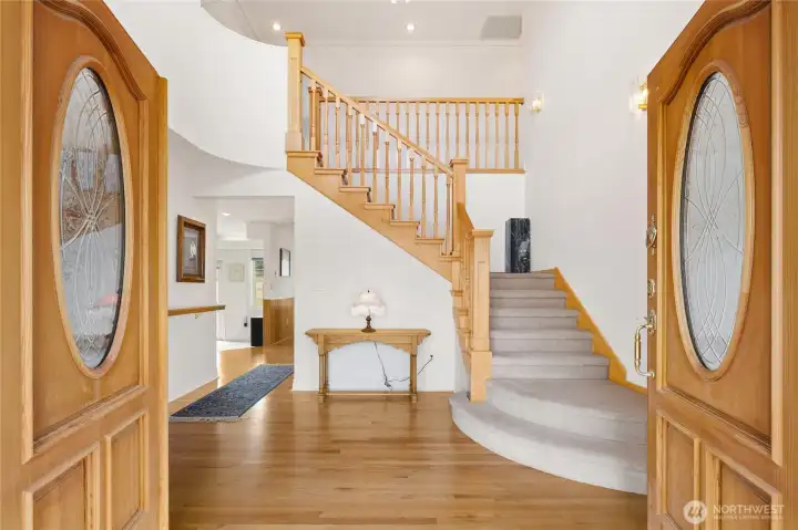 Double doors open on the entrance hall