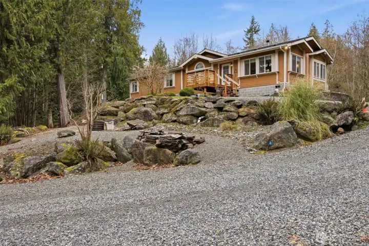 This home is privately and proudly situated on a knoll adjacent to the Galbraith Trails!
