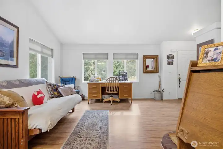 As you enter the front, you will notice the large open floor plan and the vaulted ceiling. The laminate floors flow throughout the living spaces.