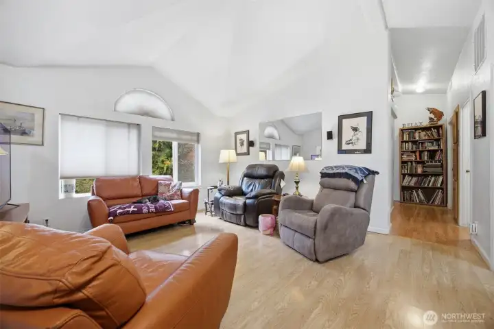 Looking across the family room with the hallway to the bedrooms and baths beyond.