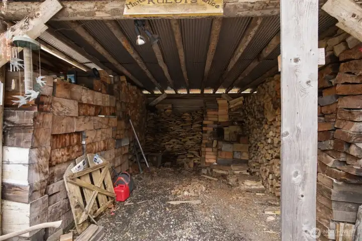 There is quite a lot of wood stored in the shed to keep that wood stove burning.
