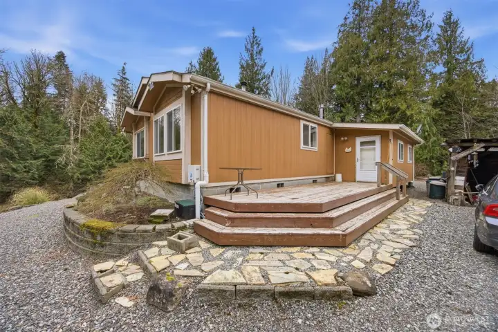 Looking across the rear side of the home to the back storage area and back porch.