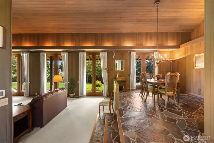Lovely flow between the dining and living space. Uplighting for ambiance