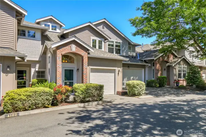 Welcome home... pleasant craftsman style townhome with attached garage