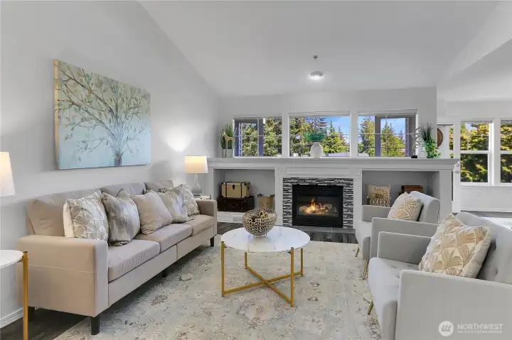 Impressive great room with cathedral ceilings, gas fireplace and flooded with natural light