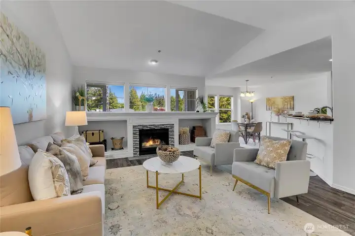 Impressive great room with cathedral ceilings, gas fireplace and flooded with natural light