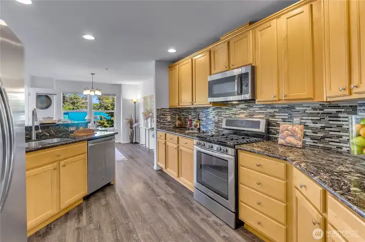 Updated kitchen with counter/bar dining, stainless appliances with gas cooking