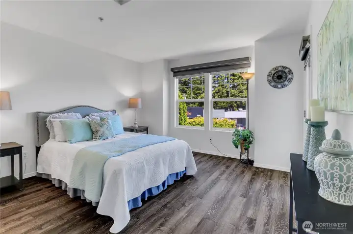 Spacious primary suite with access to the private patio
