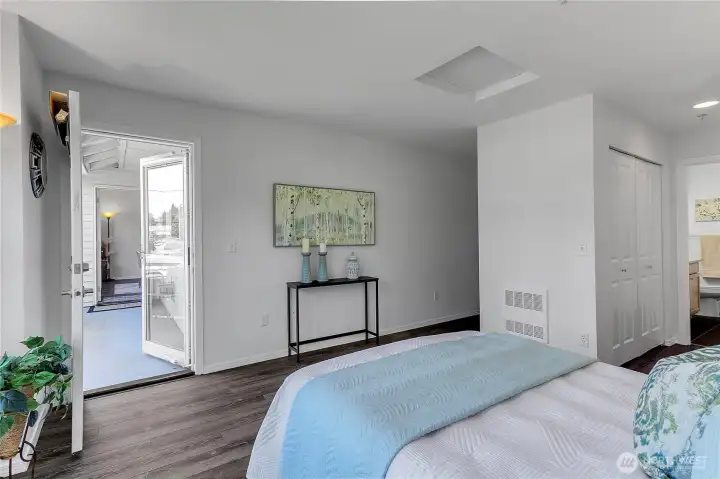 Spacious primary suite with access to the private patio
