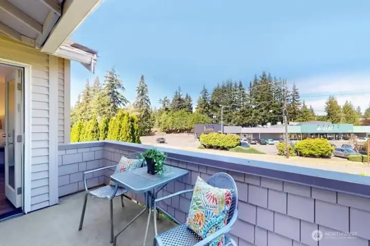 Private deck that can be accessed off primary bedroom or dining area for container gardening and dining al fresco.