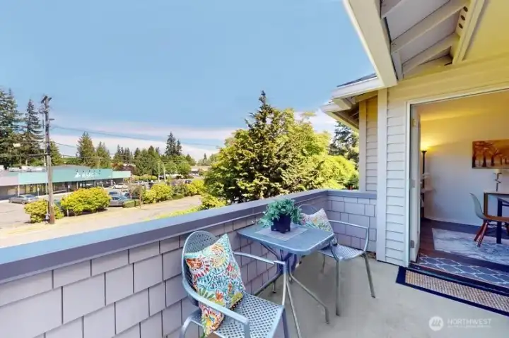 Private deck that can be accessed off primary bedroom or dining area for container gardening and dining al fresco.