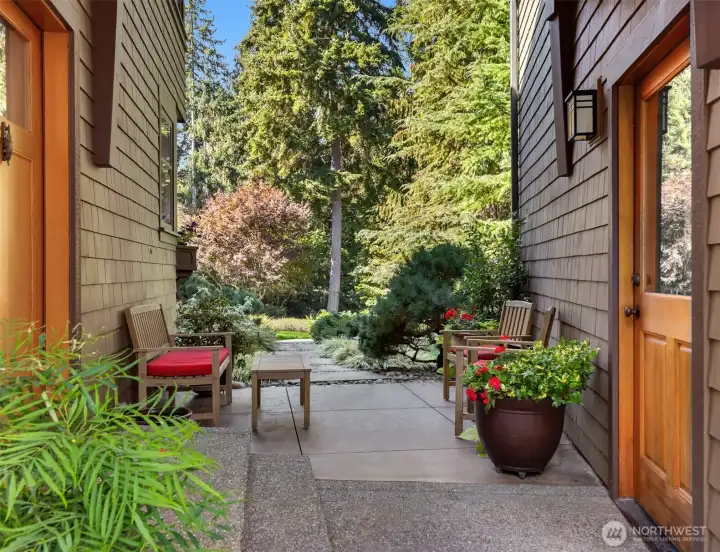 Patio between the house and detached 2-car garage