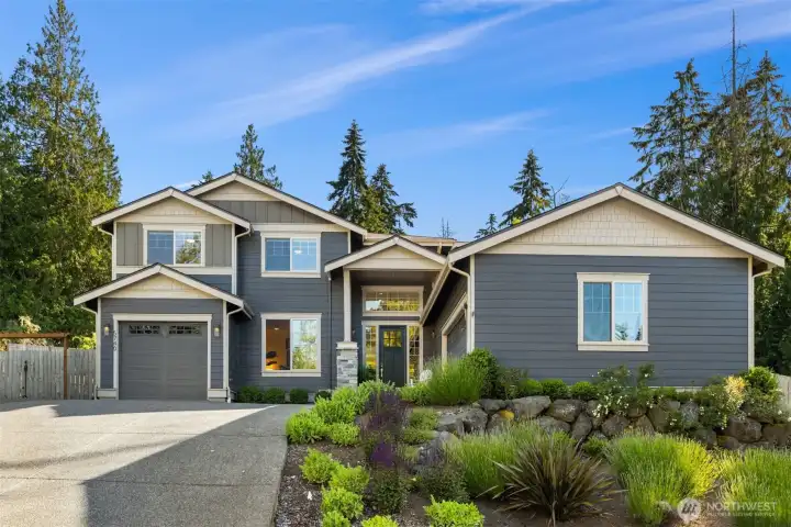 Two garage bays are on the right of the driveway entrance. The single garage bay is on the left. Two garage bays are on the right of the driveway entrance. The single garage bay is on the left.