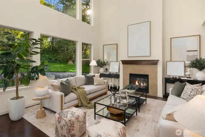 Stunning contemporary living room with 2 story ceilings of windows. Stunning contemporary living room with 2 story ceilings of windows.