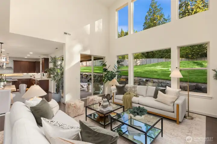 Large windows frame the out look of the back yard and patio area. Large windows frame the out look of the back yard and patio area.