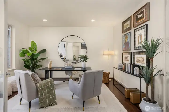 The sunny home office is spacious and bright with large windows The sunny home office is spacious and bright with large windows