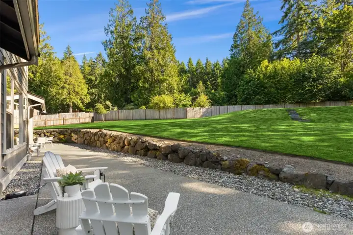 Back yard patio is accessed off the main floor primary bedroom through sliding glass doors. Back yard patio is accessed off the main floor primary bedroom through sliding glass doors.