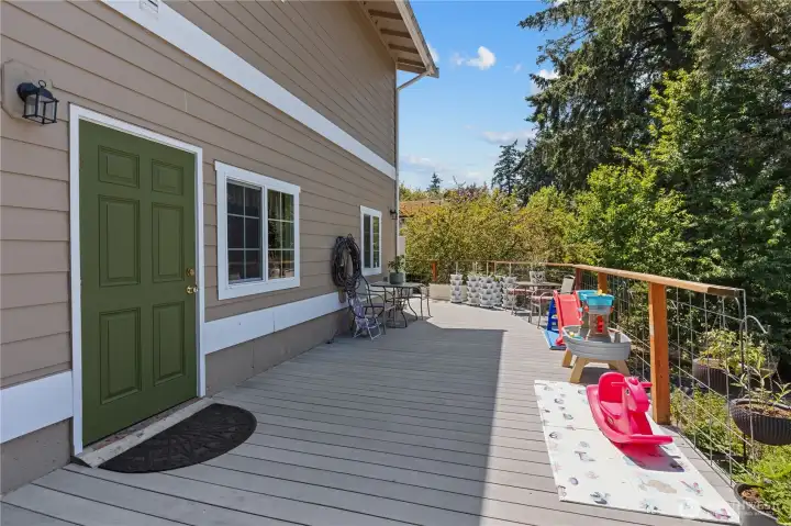 Downstairs deck elevated and overlooking backyard, which also leads to side driveway. Downstairs deck elevated and overlooking backyard, which also leads to side driveway.