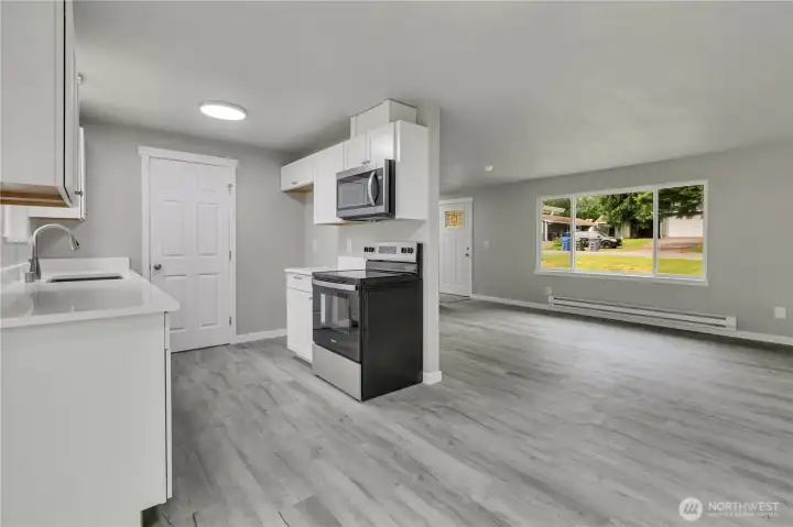 Dining room with view to kitchen and living rooms