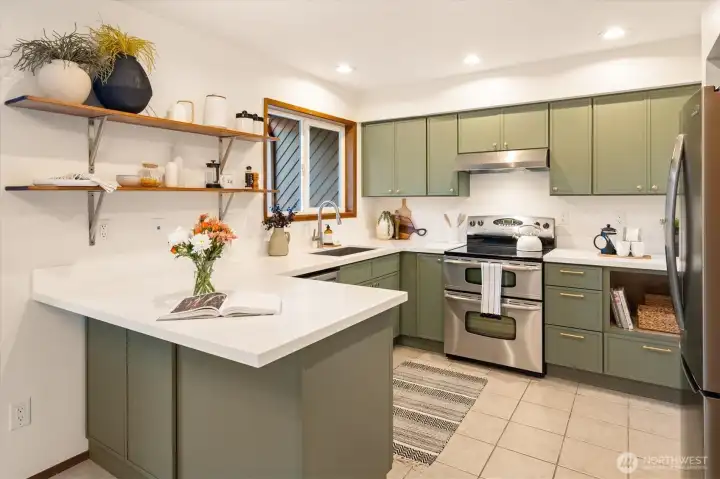 The beautifully updated kitchen is stylish and bright, with room for everyone to hang in the kitchen together. The beautifully updated kitchen is stylish and bright, with room for everyone to hang in the kitchen together.