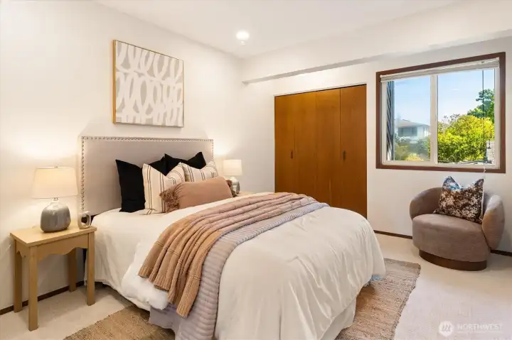 Upstairs there are two more large bedrooms, with south-facing windows and generous closets. Upstairs there are two more large bedrooms, with south-facing windows and generous closets.