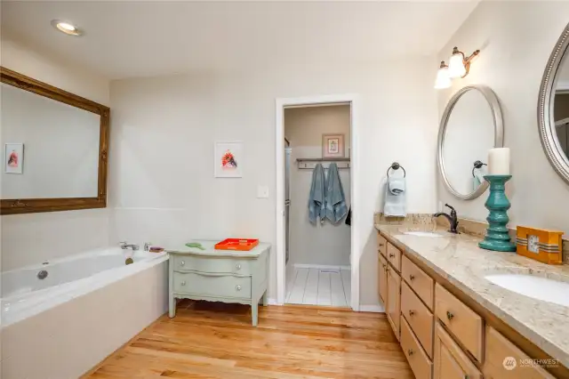 Generous primary 5-piece bath has separate shower/toilet room