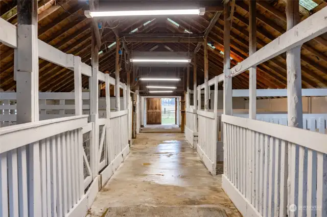 The 2224 s/f barn w/6 stalls, plus several misc. rooms, has 220 wiring & plenty of lighting.