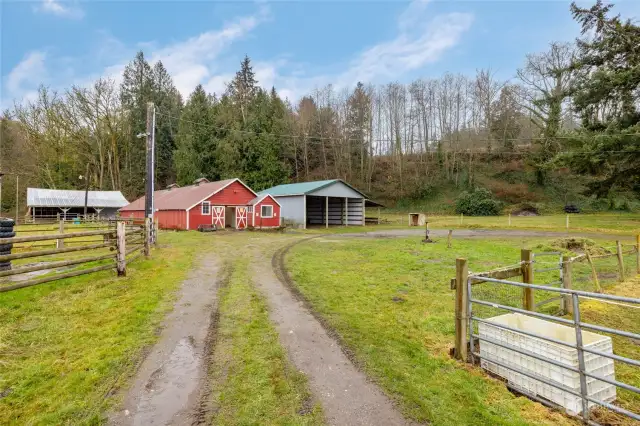 Circular driveway leads to the barn, machine shed and RV parking with full hookups.