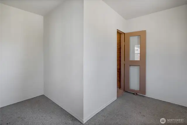 Inside second outbuilding.  Great for a home business or hobby/craft area.  Door leads to sauna.
